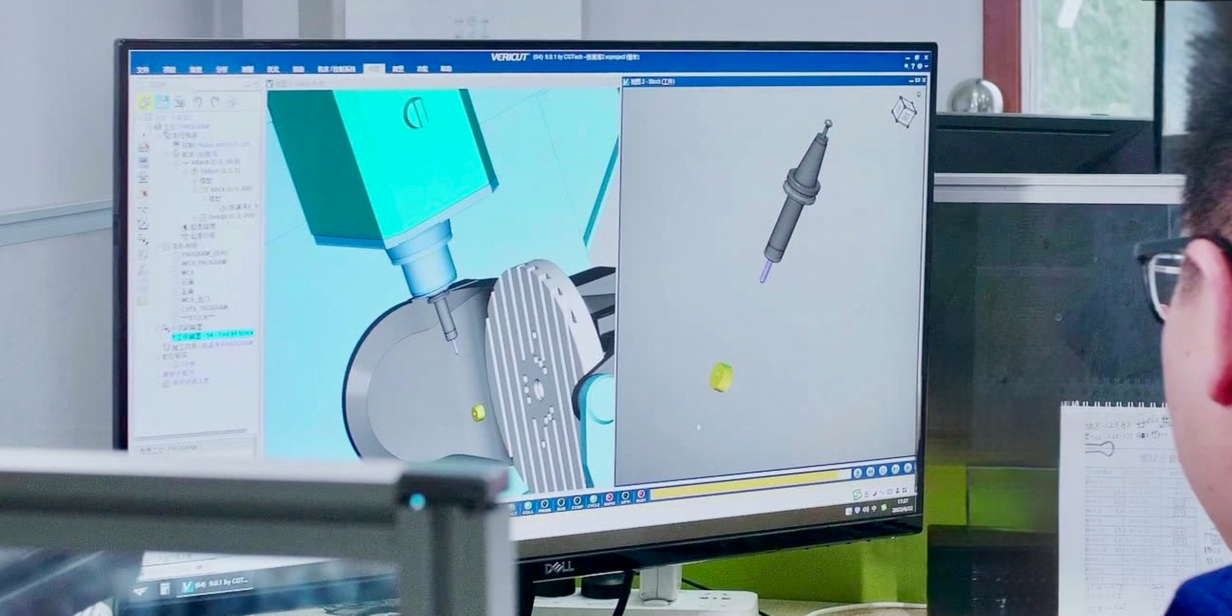 Lab worker stands at a touchscreen display, adjusting settings.